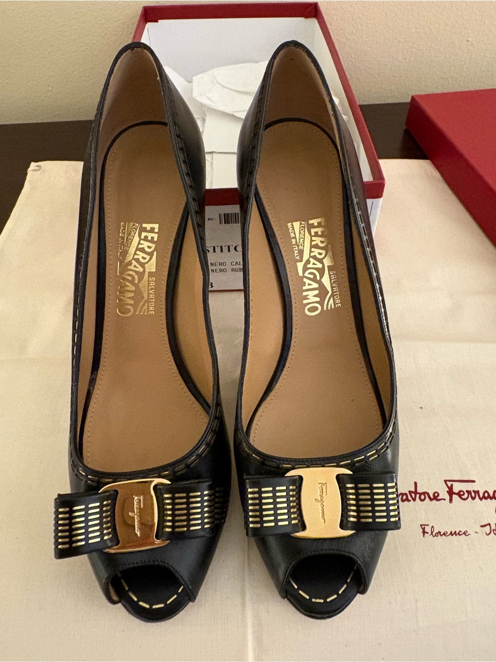 Salvatore Ferragamo Black Leather Peep-Toe Pumps with Gold Bow Accent